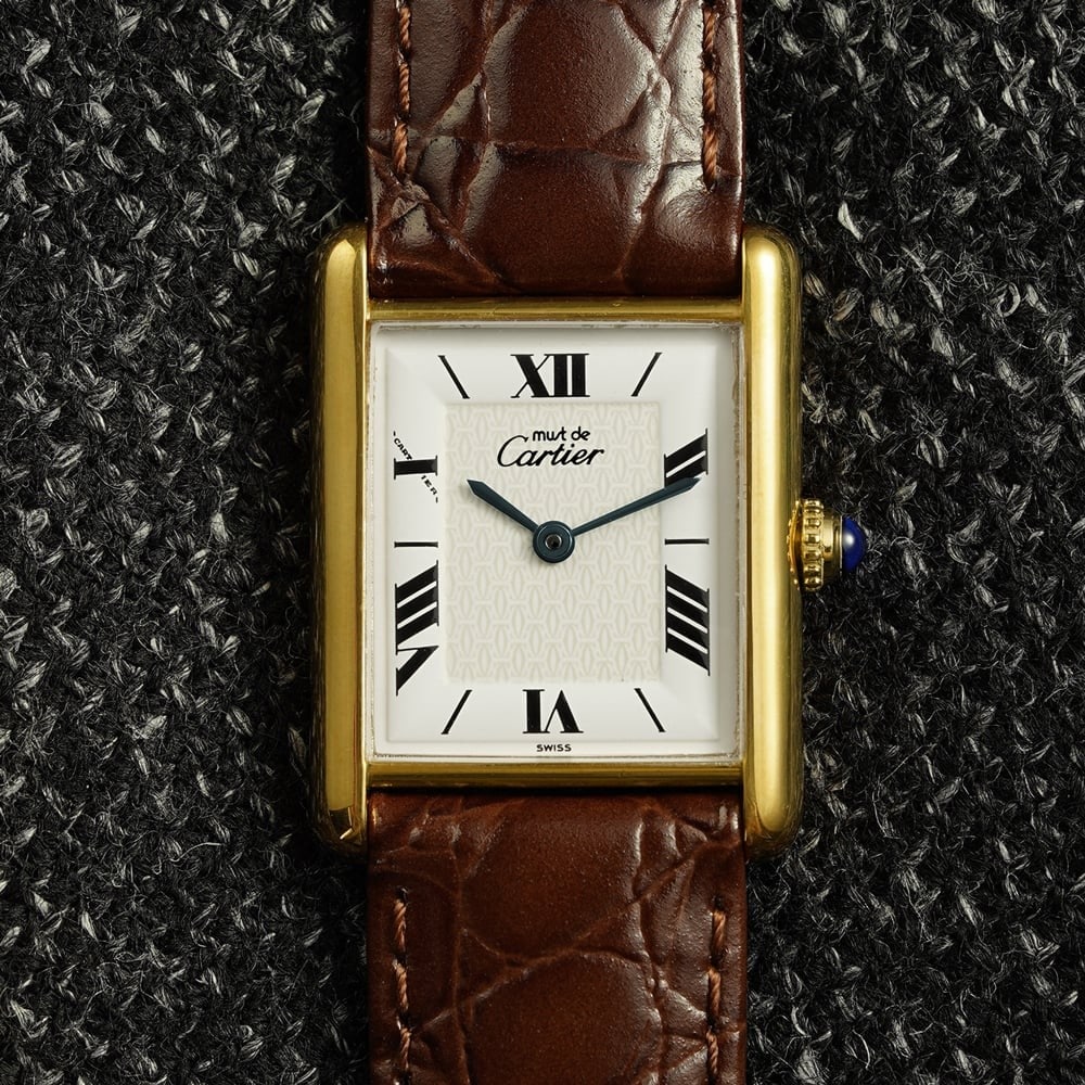 Cartier Must Tank LM 1615 mens quartz wristwatch Double C Roman dial: Cartier Must Tank LM 1615 mens quartz wristwatch Double C Roman dial A vintage Cartier Must Tank LM wristwatch with a white Roman dial and Double C logo monogram design. It features a vermeil case, qu