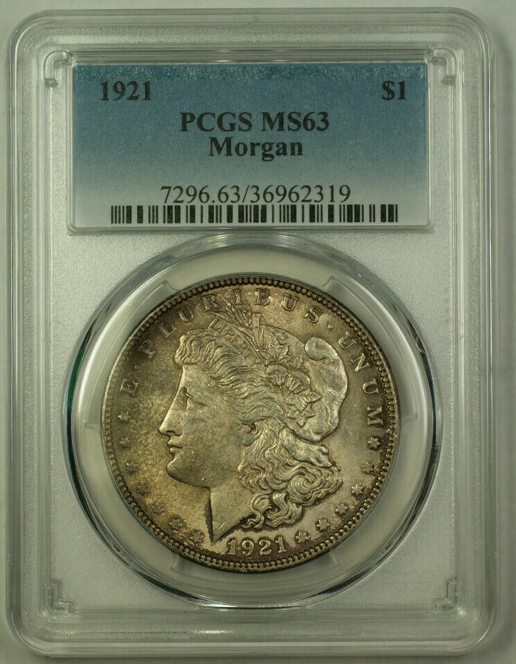 PCGS MS-63 1921 Morgan Silver Dollar Toned: PCGS MS-63 1921 Morgan Silver Dollar Toned This 1921 Morgan Silver Dollar is an uncirculated $1 coin graded MS-63 by PCGS. Struck in Philadelphia, it features a composition of 90% silver and displays 