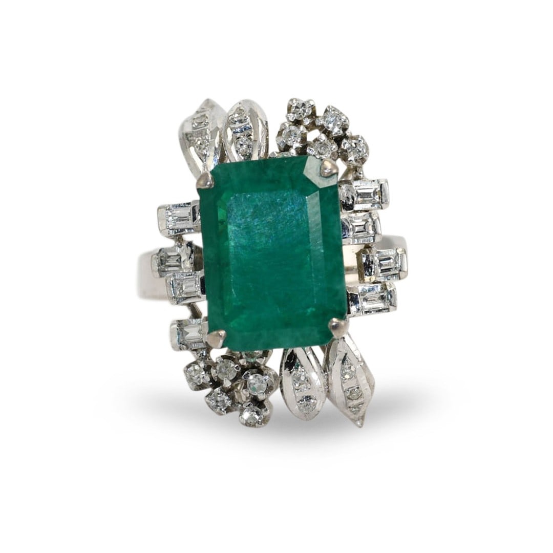 Vintage 14K White Gold Ring with Synthetic Emerald and Diamonds: Vintage 14K White Gold Ring with Synthetic Emerald and Diamonds Vintage ladies ring crafted in 14k white gold and set with a synthetic emerald accented by diamonds. The center stone is described as hy