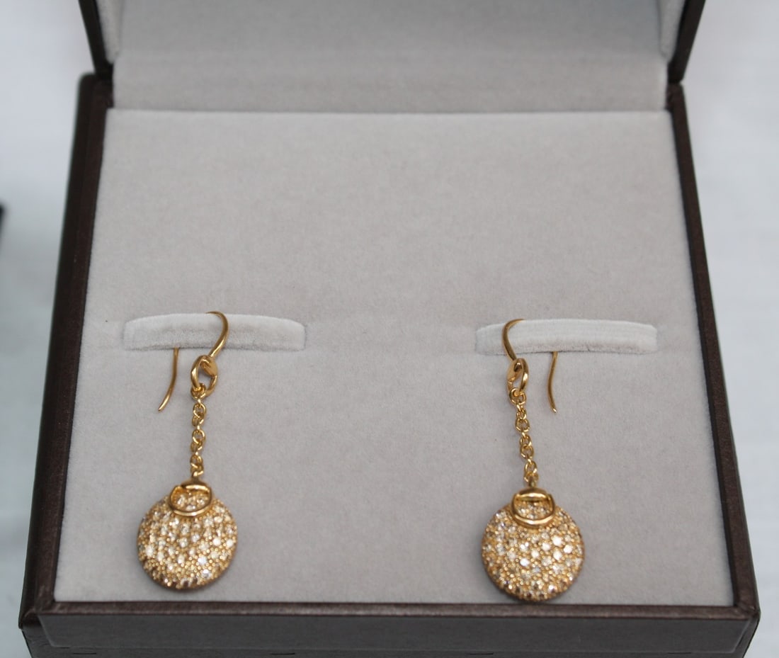 Gucci 18K Yellow Gold Diamond Chain Earrings with Bag & Box: Gucci 18K Yellow Gold Diamond Chain Earrings with Bag & Box This exquisite pair of Gucci earrings is crafted from 18K yellow gold and features dazzling diamonds. The chain earring design exhibits rema