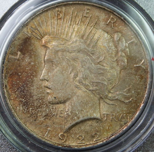 PCGS MS-63 1922 Peace Dollar Silver Coin Toned Uncirculated: PCGS MS-63 1922 Peace Dollar Silver Coin Toned Uncirculated This is a 1922 Peace Silver Dollar coin from the United States, minted in Philadelphia. Certified by PCGS with a grade of MS-63, this uncirc