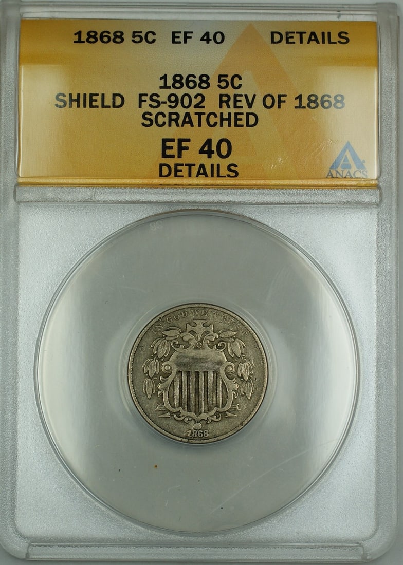 ANACS EF-40 Shield Nickel 1868 FS-902 Five Cent Coin With Scratched Reverse: ANACS EF-40 Shield Nickel 1868 FS-902 Five Cent Coin With Scratched Reverse This is an 1868 Shield Nickel 5-cent coin graded EF-40 Details by ANACS. The coin is circulated and features a scratched rev