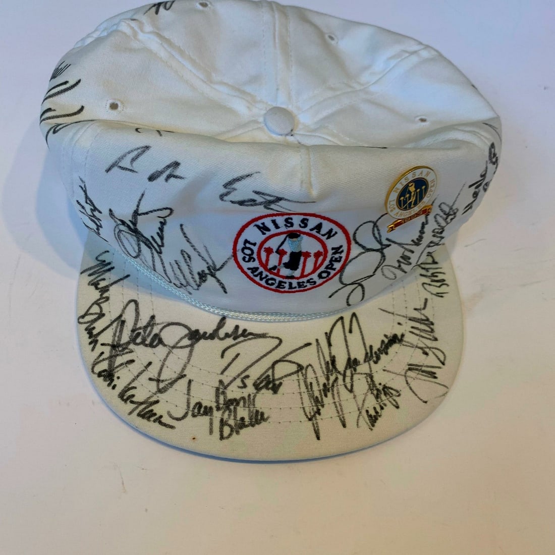 1993 Nissan Open Signed Golf Cap with 22 Autographs JSA COA: 1993 Nissan Open Signed Golf Cap with 22 Autographs JSA COA This unique PGA volunteer marshal's hat from the 1993 Nissan Los Angeles Open features the autographs of 22 professional golfers, making it 