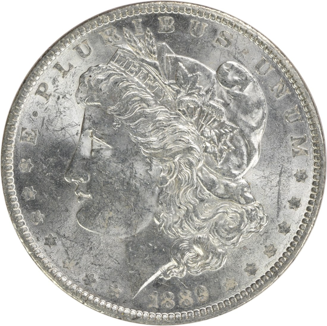 Brilliant Uncirculated 1889 Morgan Silver Dollar Uncertified No Mint Mark: Brilliant Uncirculated 1889 Morgan Silver Dollar Uncertified No Mint Mark This is an 1889 Morgan Silver Dollar from the United States, featuring a brilliant uncirculated (BU) grade. The coin is compos