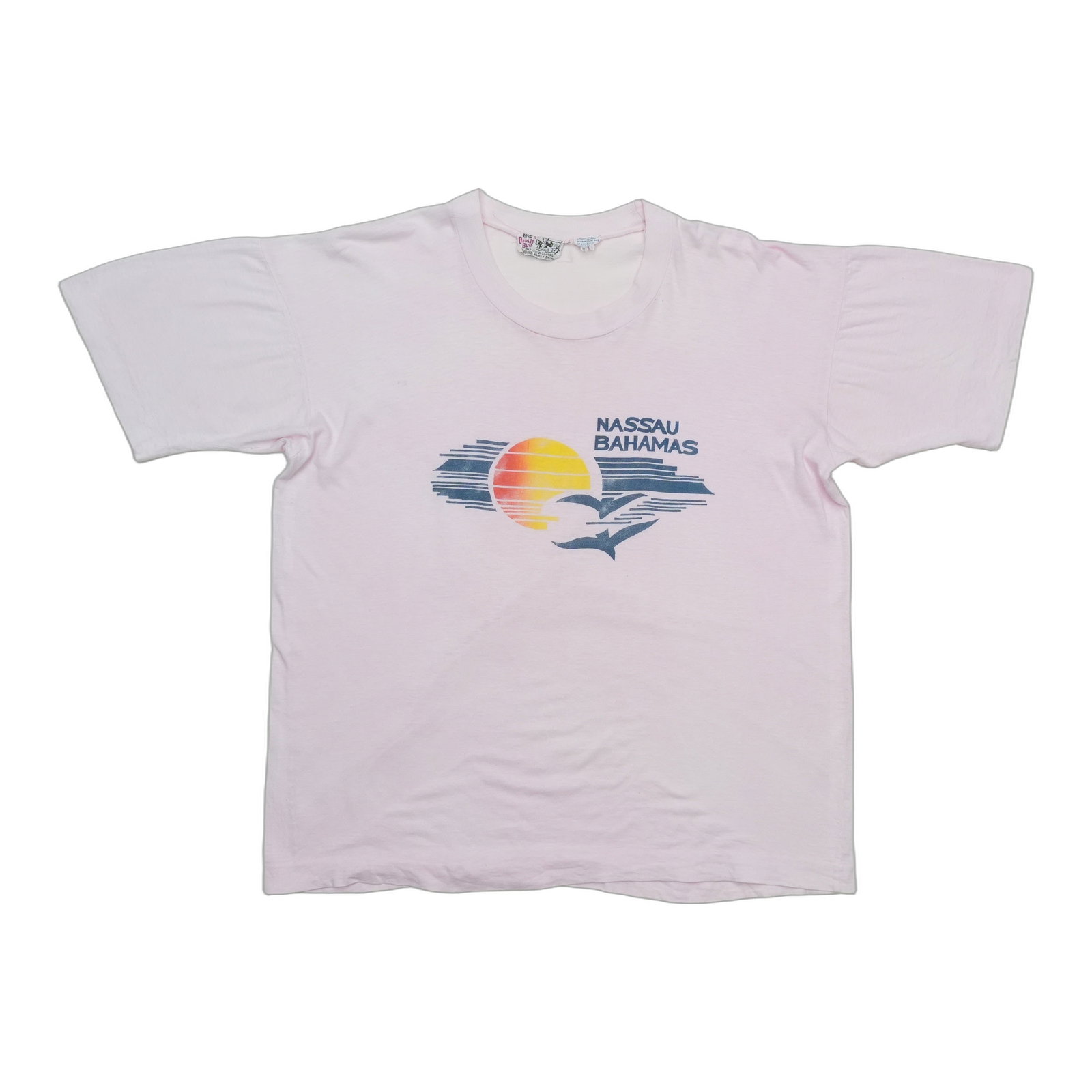 Vintage Pink Cotton Nassau Bahamas Graphic Shirt: Vintage Pink Cotton Nassau Bahamas Graphic Shirt This is an original vintage 1970s Nassau Bahamas Sunset shirt featuring a front graphic design. The shirt is made from 100% cotton in pink and is not a