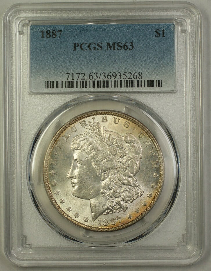 PCGS MS-63 1887 Morgan $1 Silver Dollar with Reverse Toning: PCGS MS-63 1887 Morgan $1 Silver Dollar with Reverse Toning This is an 1887 Morgan Silver Dollar $1 coin from the United States, minted in Philadelphia. The coin is composed of 90% silver and is certi