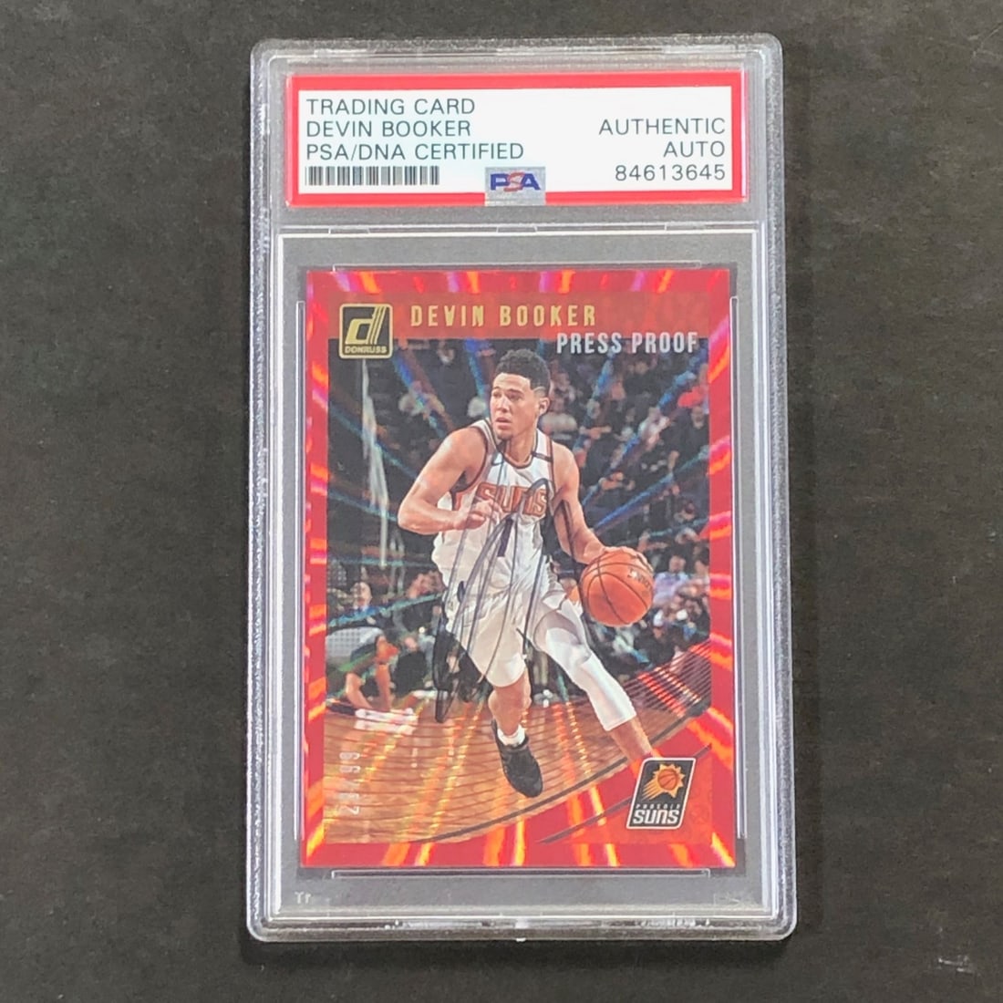 2018-19 Donruss #199 Devin Booker Autographed Card PSA Certified: 2018-19 Donruss #199 Devin Booker Autographed Card PSA Certified Own a piece of basketball history with this 2018-19 Donruss #199 card, autographed by NBA star Devin Booker of the Phoenix Suns. This c