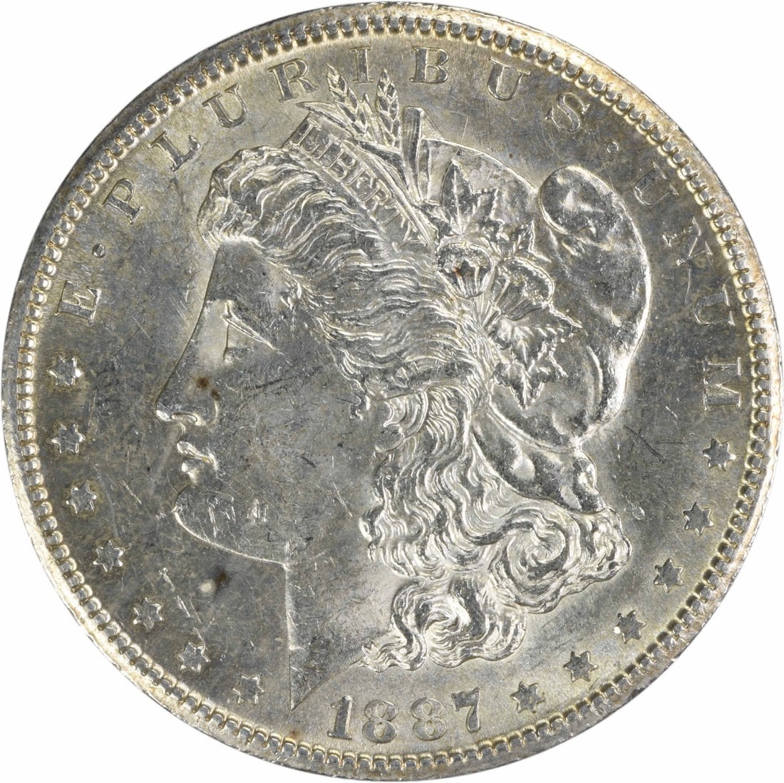 1887-S Morgan Silver Dollar AU Uncertified 90% Silver: 1887-S Morgan Silver Dollar AU Uncertified 90% Silver This 1887-S Morgan Silver Dollar is a remarkable collectible coin, featuring a design by George T. Morgan. The coin is a beautiful representation 