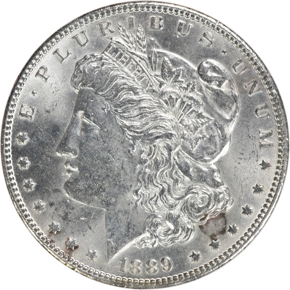 Brilliant Uncirculated 1889 Silver Dollar Morgan No Mint Mark Uncertified: Brilliant Uncirculated 1889 Silver Dollar Morgan No Mint Mark Uncertified This 1889 Morgan Silver Dollar is an uncirculated coin in Brilliant Uncirculated (BU) condition. It is composed of silver and 