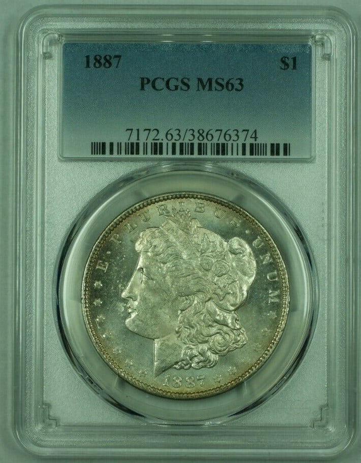 PCGS MS63 PL 1887 Morgan $1 Silver Dollar: PCGS MS63 PL 1887 Morgan $1 Silver Dollar 1887 Morgan Silver Dollar certified by PCGS and graded MS-63 with a Proof-Like strike. This United States $1 coin is an uncirculated pre-owned example compose