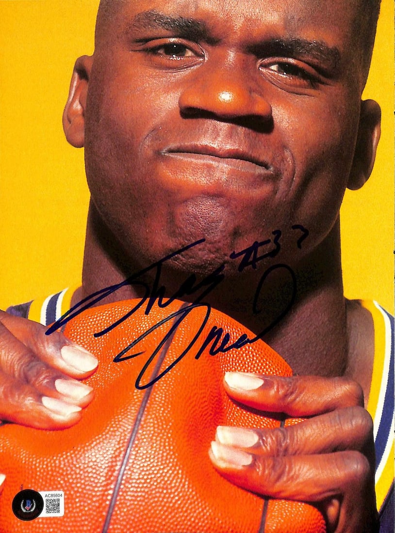 Beckett authenticated Shaquille O'Neal signed LSU magazine photo 81/2 x 11: Beckett authenticated Shaquille O'Neal signed LSU magazine photo 81/2 x 11 Hand-signed vintage magazine photo of Shaquille O'Neal featuring a bold autograph across the front. The piece is authenticate