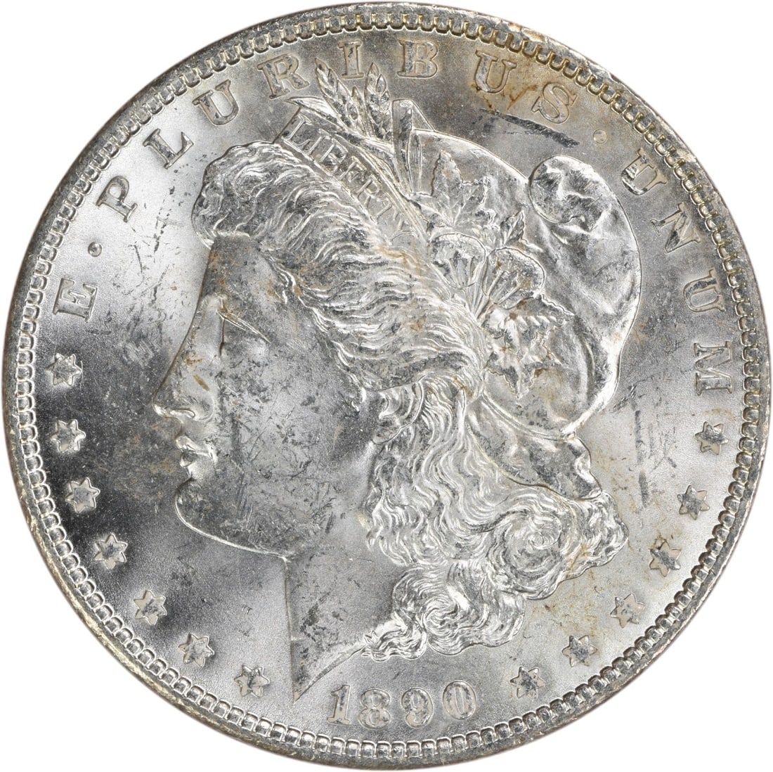 Uncirculated 1890 Morgan Dollar Silver Coin Brilliant Uncertified No Mint Mark: Uncirculated 1890 Morgan Dollar Silver Coin Brilliant Uncertified No Mint Mark This 1890 Morgan Silver Dollar is an uncirculated coin featuring brilliant uncirculated (BU) grade. Composed of silver an