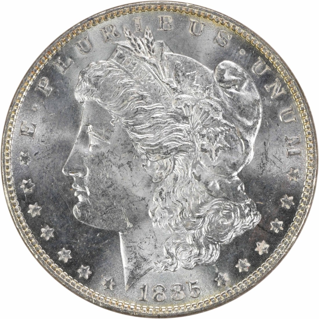 1885 Silver Morgan Dollar Choice Brilliant Uncirculated Uncertified Coin: 1885 Silver Morgan Dollar Choice Brilliant Uncirculated Uncertified Coin This 1885 Morgan Silver Dollar is a Choice Brilliant Uncirculated coin, featuring a silver composition and no mint mark. It rem