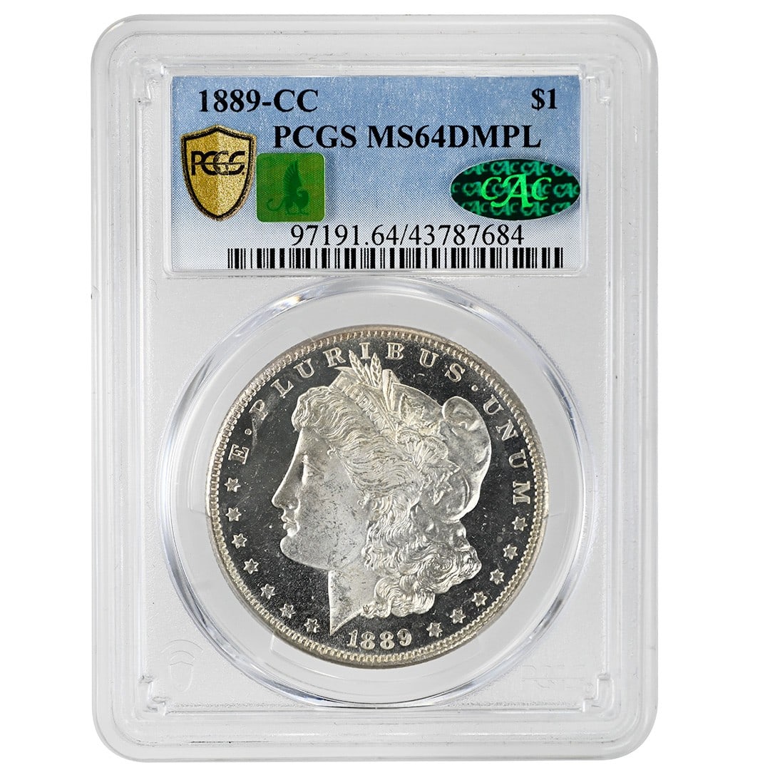 PCGS CAC 1889-CC Morgan Silver Dollar MS64DMPL: PCGS CAC 1889-CC Morgan Silver Dollar MS64DMPL 1889-CC Morgan Silver Dollar certified by PCGS and CAC with an MS64DMPL grade. This Carson City issue is an uncirculated rare coin with deep mirror proof
