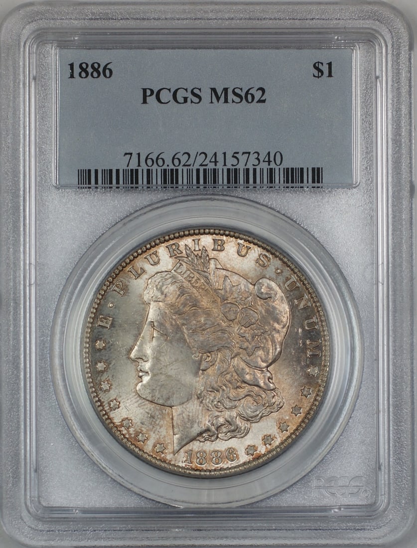 PCGS MS62 1886 Morgan silver dollar toned: PCGS MS62 1886 Morgan silver dollar toned This 1886 Morgan Silver Dollar is graded MS-62 by PCGS and features attractive toning. Struck in Philadelphia, it is composed of silver and remains uncirculat
