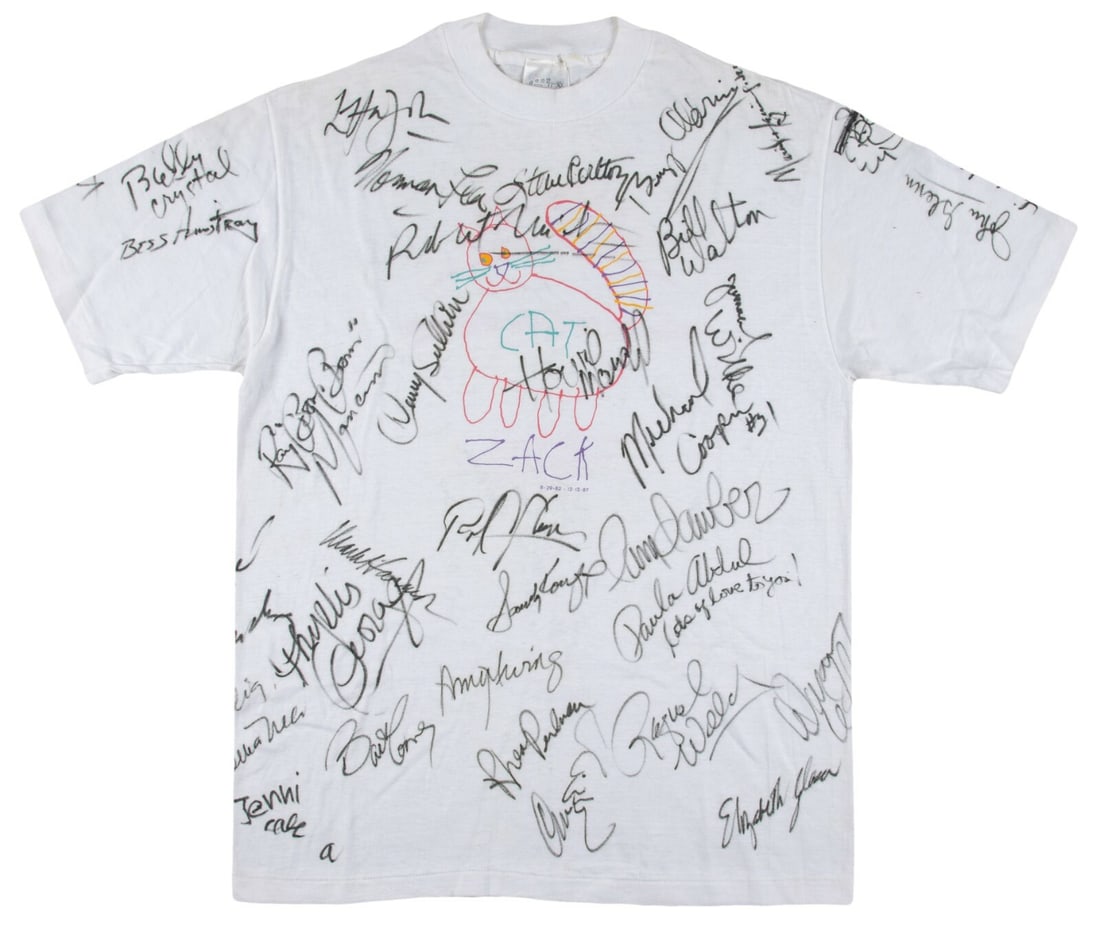 Celebrity Signed T-Shirt with 32 Autographs John Glenn Buzz Aldrin JSA LOA: Celebrity Signed T-Shirt with 32 Autographs John Glenn Buzz Aldrin JSA LOA This remarkable size "L-42-44" white t-shirt is adorned with the signatures of over 32 renowned celebrities and athletes, inc