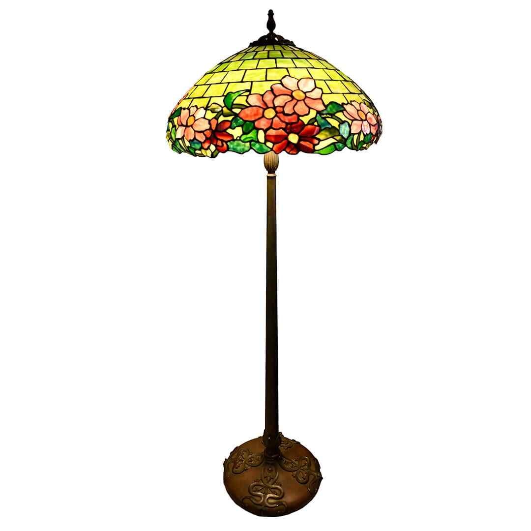 Duffner Kimberly stained glass peony floor lamp with bronze base: Duffner Kimberly stained glass peony floor lamp with bronze base This Duffner & Kimberly Peony floor lamp features a vibrant stained glass shade with intricate peony motifs and a solid bronze base fin