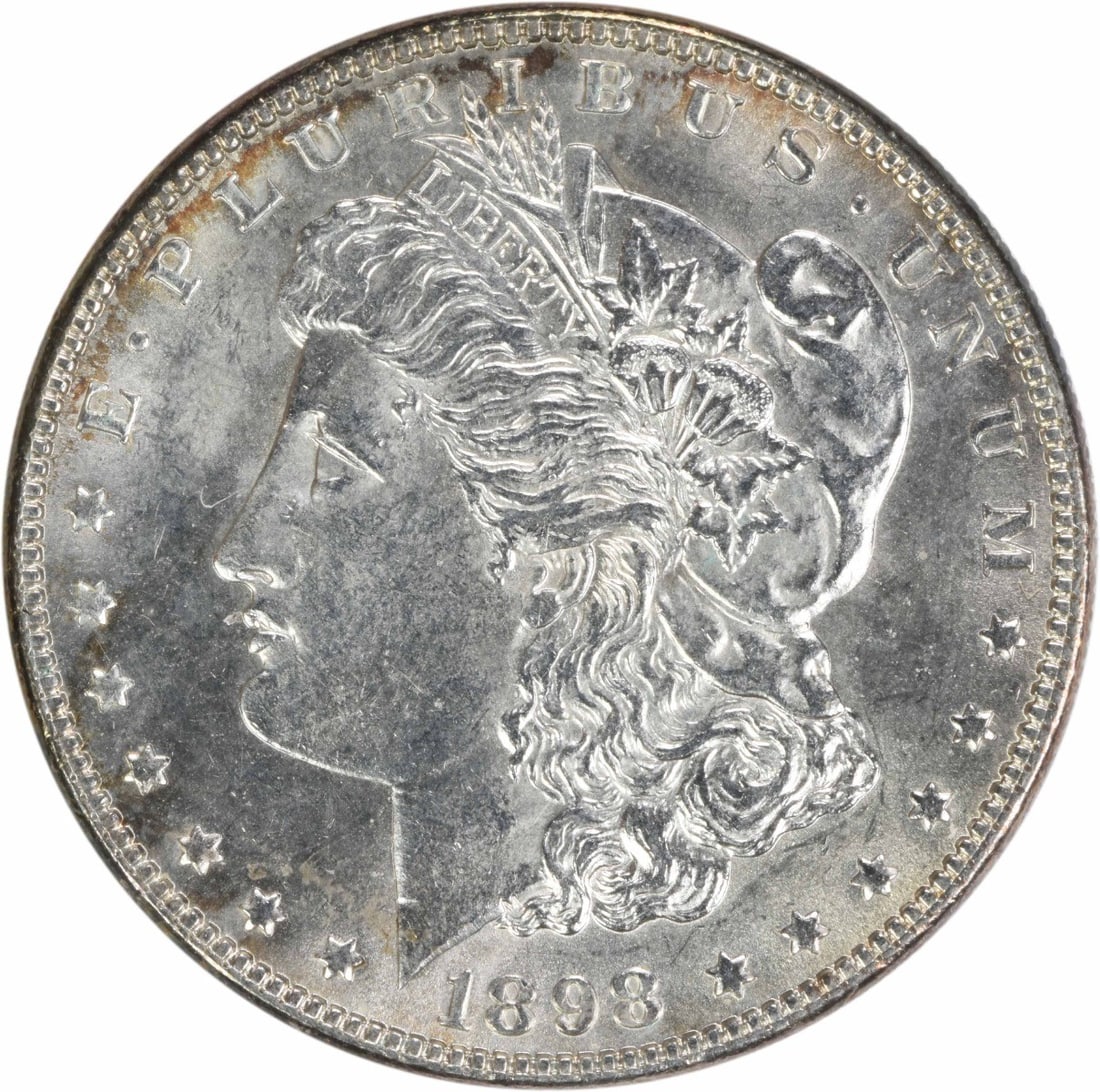 Uncirculated 1898 Silver Morgan Dollar Brilliant Uncirculated Uncertified: Uncirculated 1898 Silver Morgan Dollar Brilliant Uncirculated Uncertified This is an 1898 Morgan Silver Dollar in brilliant uncirculated (BU) condition. The coin is uncertified and features no mint ma