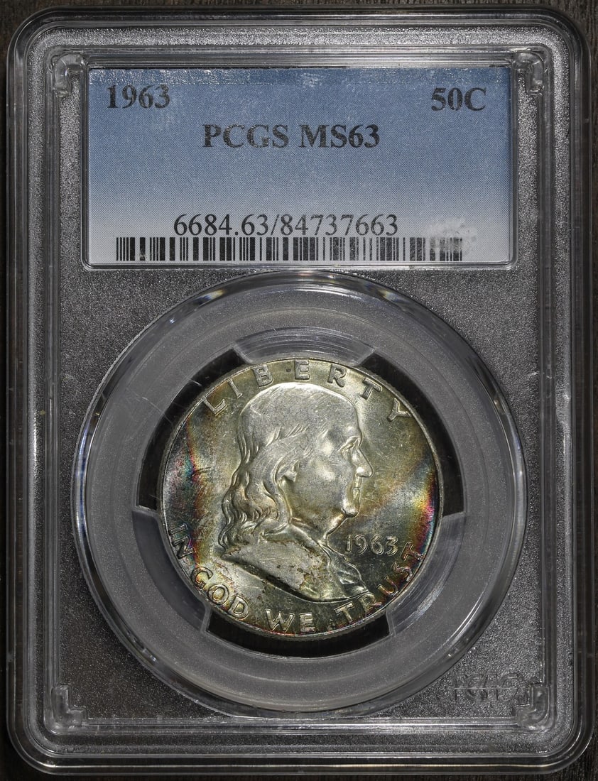PCGS MS63 1963 Franklin 50C Silver Half Dollar Rainbow Toning: PCGS MS63 1963 Franklin 50C Silver Half Dollar Rainbow Toning 1963 Franklin Half Dollar 50C graded MS63 by Professional Coin Grading Service (PCGS). This pre-owned coin is composed of silver with 0.9 