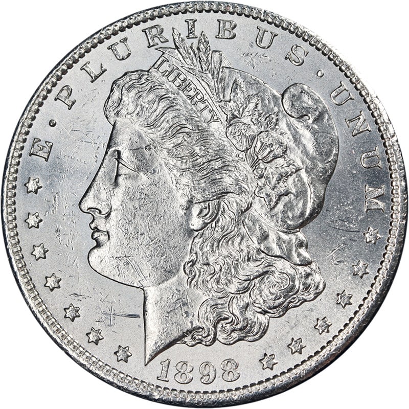 Uncirculated 1898-S Morgan Dollar Brilliant Uncirculated Silver Coin: Uncirculated 1898-S Morgan Dollar Brilliant Uncirculated Silver Coin This 1898-S Morgan Silver Dollar features bright white surfaces, fantastic luster, and a strong strike. The coin is in Brilliant Un