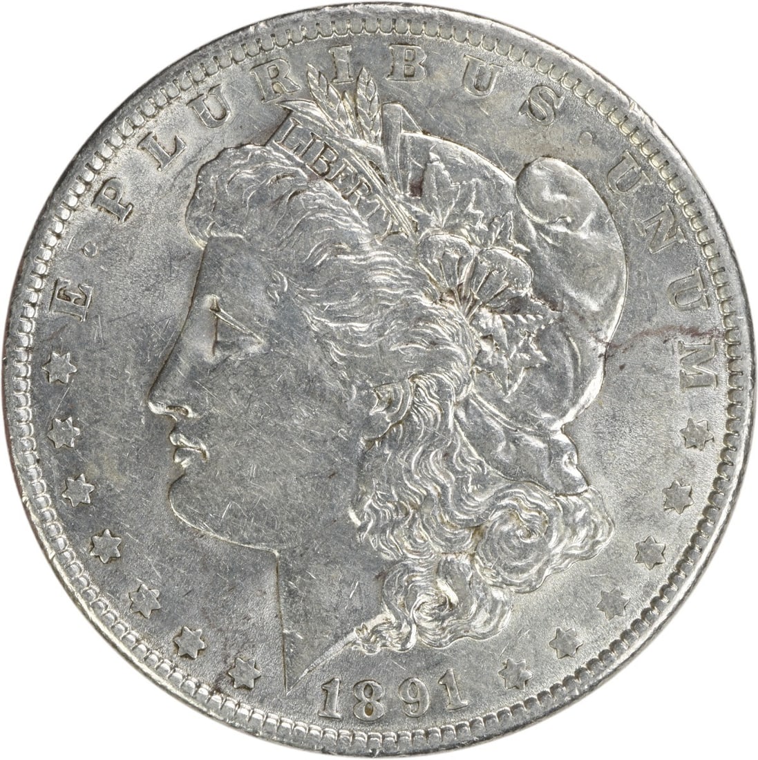 1891 Morgan Silver Dollar AU Uncertified 90% Silver Coin Philadelphia: 1891 Morgan Silver Dollar AU Uncertified 90% Silver Coin Philadelphia This 1891 Morgan Silver Dollar is a beautiful coin that showcases the artistry of designer George T. Morgan. It features a composi