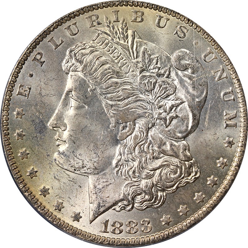 PCGS MS63 1883 O Morgan Silver Dollar Toning: PCGS MS63 1883 O Morgan Silver Dollar Toning This 1883-O Morgan Silver Dollar is graded MS63 by PCGS and features attractive toning. Struck in 90% silver at the New Orleans Mint, this uncirculated coi