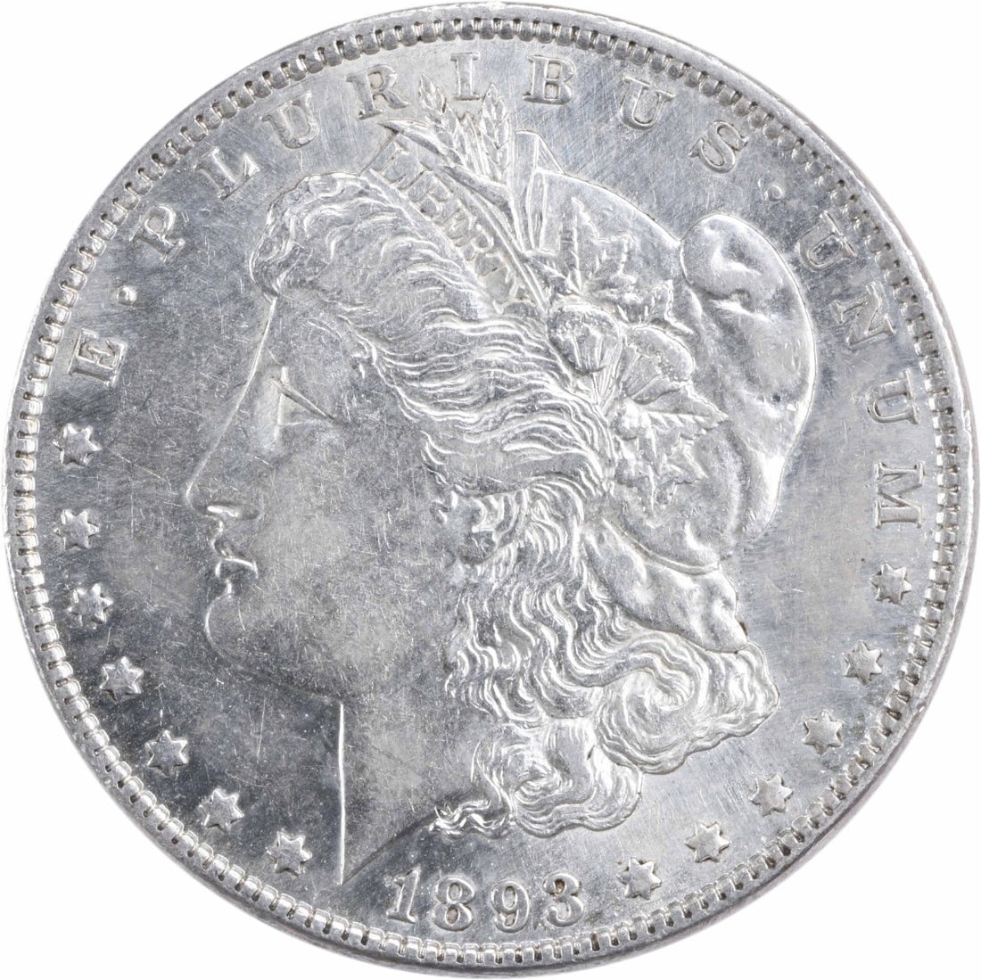 1893 Morgan Silver Dollar AU Uncertified 90% Silver Coin: 1893 Morgan Silver Dollar AU Uncertified 90% Silver Coin This 1893 Morgan Silver Dollar showcases a grade of AU (Almost Uncirculated) and is a remarkable piece of American numismatic history. Struck i