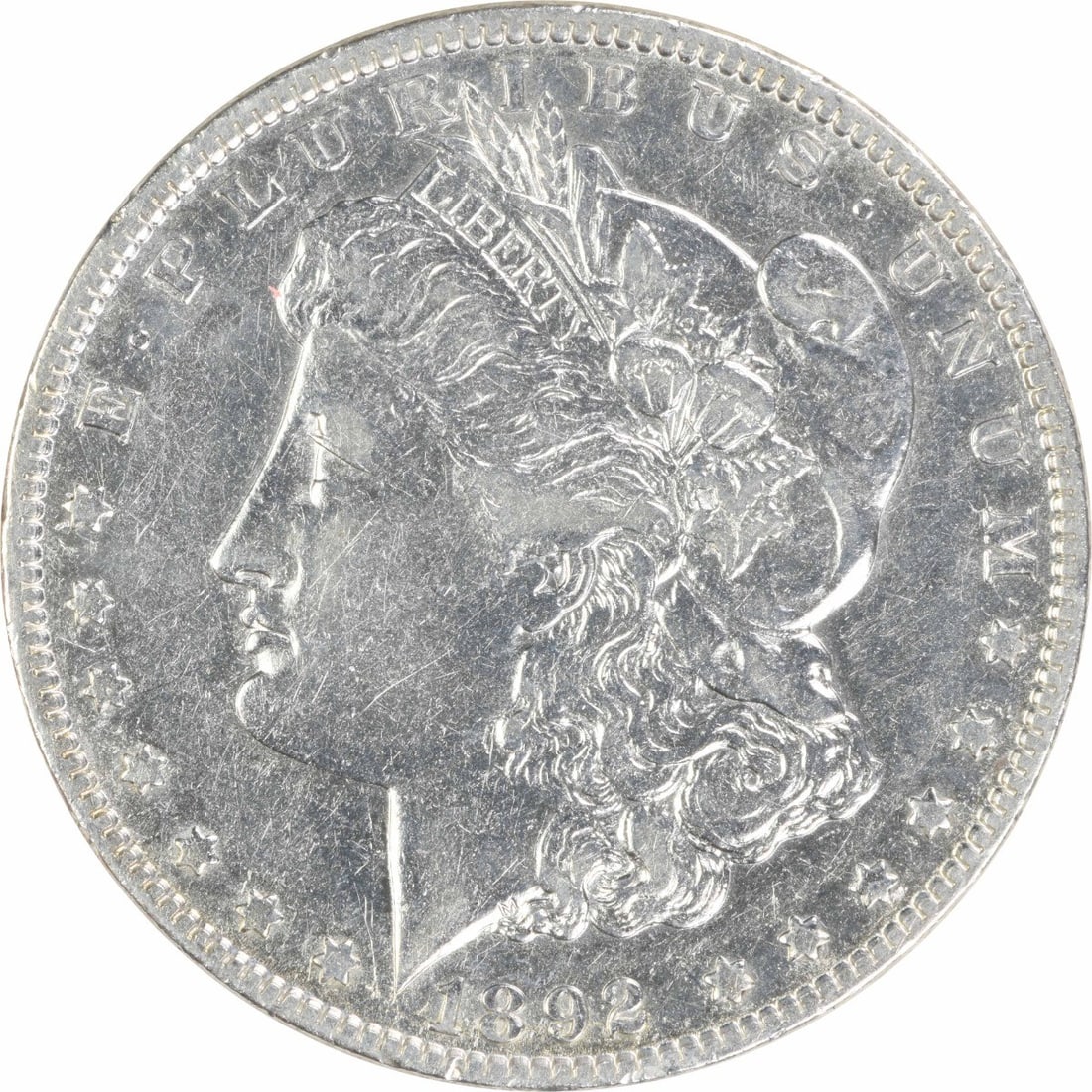 1892 $1 Morgan Silver Dollar EF Circulated Uncertified: 1892 $1 Morgan Silver Dollar EF Circulated Uncertified 1892 Morgan Silver Dollar in EF grade. This circulated, uncertified coin is composed of silver and is a pre-owned example from the United States.