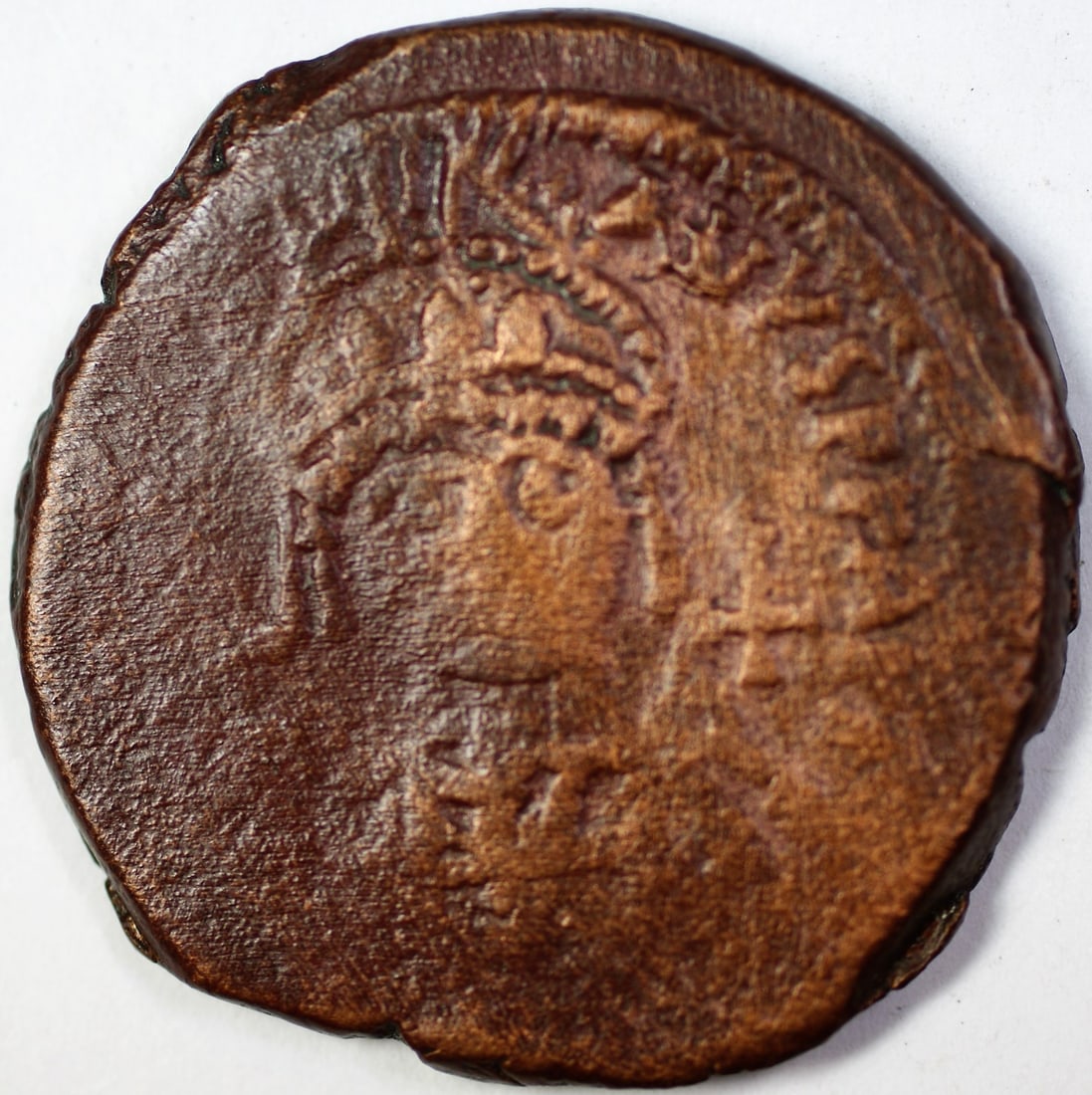 Justinian I Byzantine copper follis coin legible: Justinian I Byzantine copper follis coin legible This is a copper follis coin from the reign of Justinian I, dating between 527-565 AD CE. The coin originates from Italy and features legible details. 