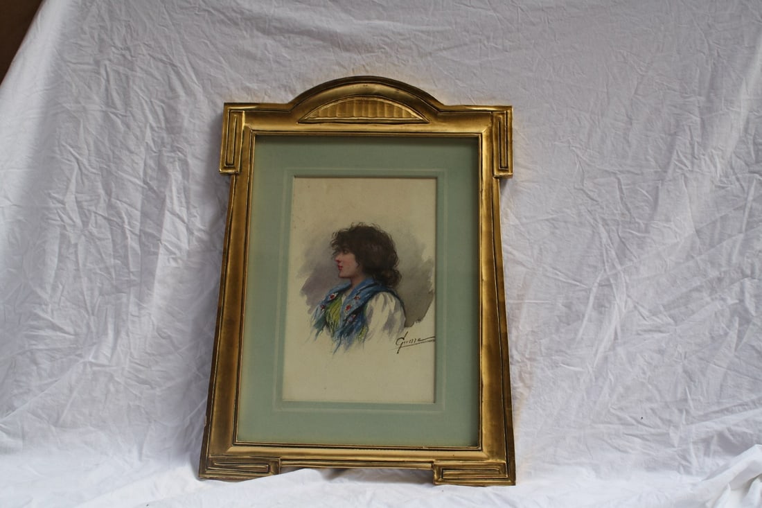 1930s Watercolor Painting of Young Girl by Jose Guerro in Gold Leaf Frame: 1930s Watercolor Painting of Young Girl by Jose Guerro in Gold Leaf Frame Discover a stunning watercolor painting from the 1930s by renowned artist Jose Guerro. This beautiful artwork features a lovel