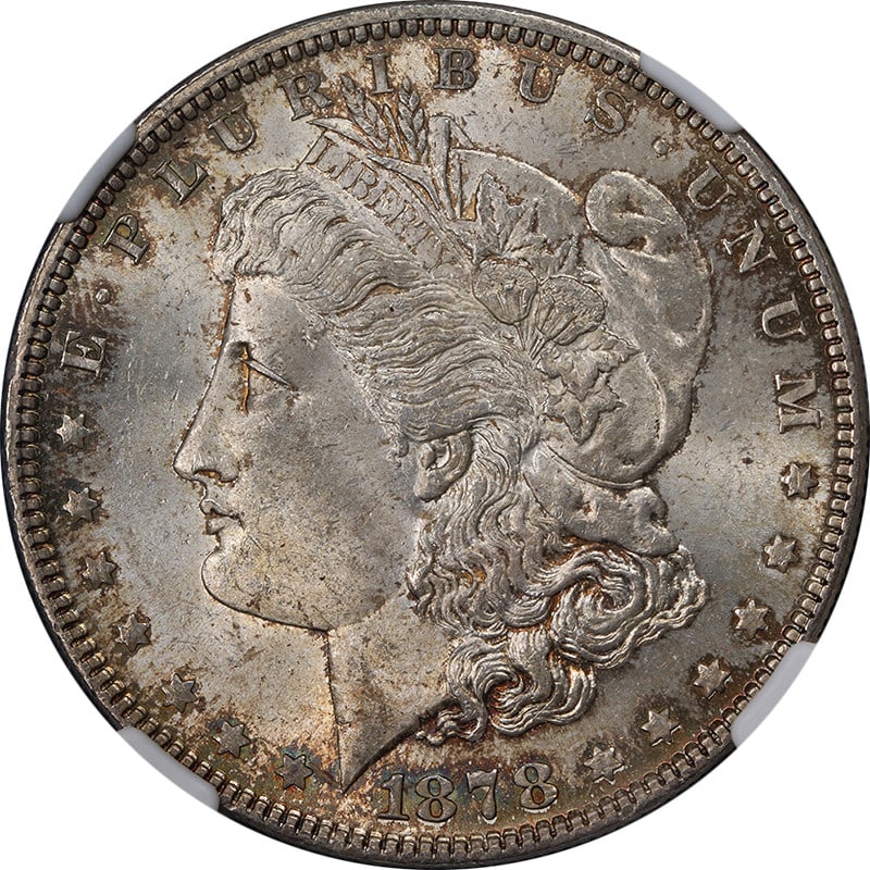 1878-P Morgan Silver Dollar NGC MS63 Uncirculated Nice Luster: 1878-P Morgan Silver Dollar NGC MS63 Uncirculated Nice Luster This stunning 1878-P 7TF Rev 79 Morgan Silver Dollar showcases exceptional eye appeal with nice luster and a strong strike. The coin featu
