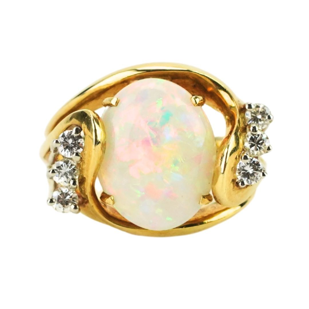 18k Yellow Gold Opal Diamond Cocktail Ring Size 6 4.75ct: 18k Yellow Gold Opal Diamond Cocktail Ring Size 6 4.75ct This elegant cocktail ring is expertly crafted in 18K yellow gold and features a stunning 4.75 carat solid Australian opal as its centerpiece, 