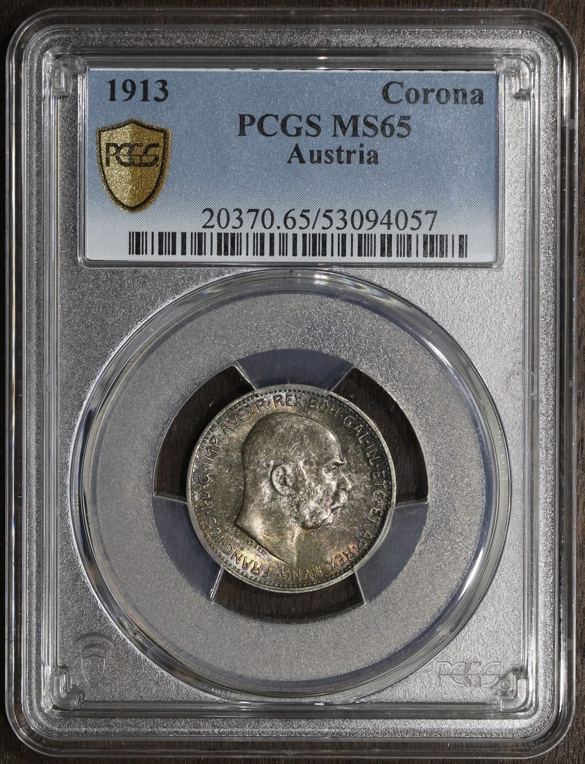 Austria 1913 Silver 1 Corona PCGS MS65 Rainbow Toning: Austria 1913 Silver 1 Corona PCGS MS65 Rainbow Toning This 1913 Austria Franz Joseph 1 Corona silver coin is graded MS65 by PCGS, indicating a high-quality, uncirculated example. The coin is composed 