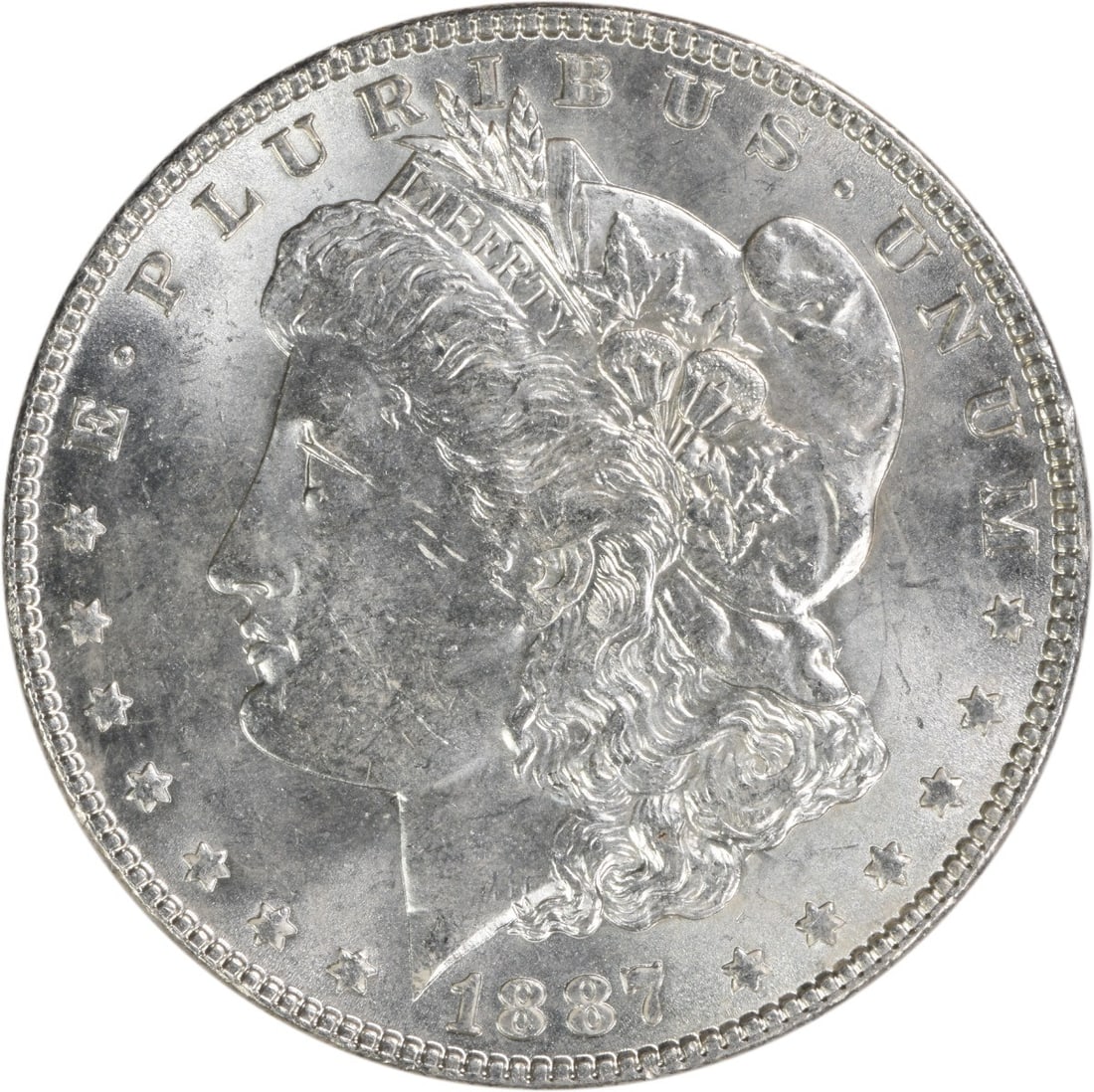 Uncirculated 1887 Silver Morgan Dollar Brilliant Uncertified No Mint Mark: Uncirculated 1887 Silver Morgan Dollar Brilliant Uncertified No Mint Mark This is an 1887 Morgan Silver Dollar from the United States in Brilliant Uncirculated (BU) condition. The coin is uncertified,