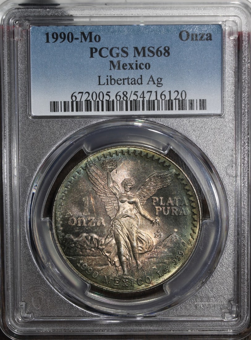 PCGS MS68 1990-Mo Mexico Silver Libertad Onza 1 oz Coin: PCGS MS68 1990-Mo Mexico Silver Libertad Onza 1 oz Coin This is a 1990 Mexico 1 oz Silver Libertad Onza coin graded MS 68 by PCGS. It is composed of 0.999 fine silver and is described as pre-owned, wi