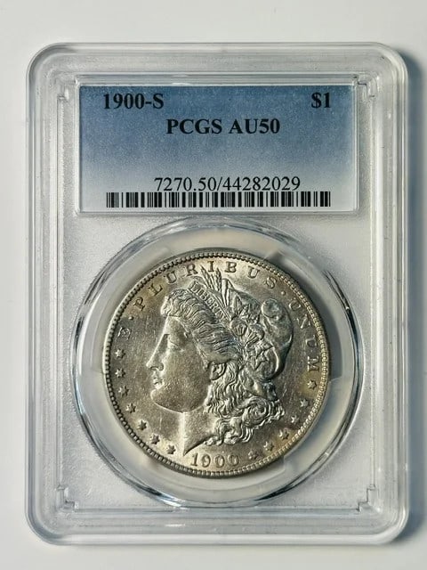 PCGS AU-50 1900-S Morgan Silver Dollar Coin: PCGS AU-50 1900-S Morgan Silver Dollar Coin 1900-S Morgan Silver Dollar certified by PCGS and graded AU-50. This pre-owned silver dollar is a United States issue with a $1 denomination. Specifications