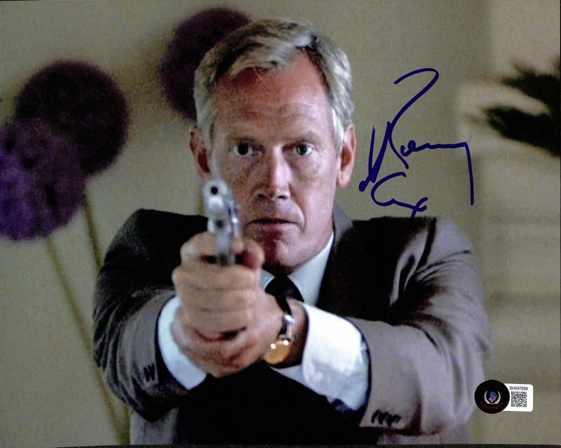 Ronny Cox Signed 8x10 Lt. Bogomil Photograph BECKETT Certified: Ronny Cox Signed 8x10 Lt. Bogomil Photograph BECKETT Certified This is an autographed 8x10 photograph of Ronny Cox, known for his role as Lt. Bogomil in the classic film Beverly Hills Cop. The signatu
