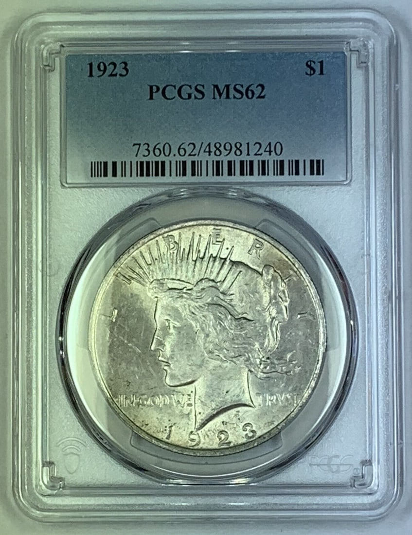 1923 Peace Silver Dollar PCGS Certified MS 62 US Coin: 1923 Peace Silver Dollar PCGS Certified MS 62 US Coin This 1923 Peace Silver $1 Dollar Coin is certified by PCGS with a grade of MS 62. It is an uncirculated coin composed of silver, originating from 