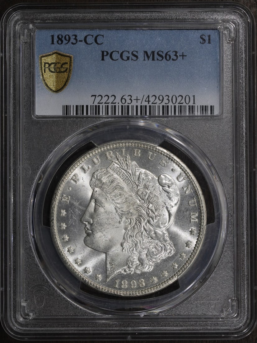PCGS MS63+ 1893-CC Morgan Dollar Carson City Silver $1 Coin: PCGS MS63+ 1893-CC Morgan Dollar Carson City Silver $1 Coin 1893-CC Morgan Silver Dollar graded MS63+ by PCGS. This pre-owned United States $1 coin is struck in 0.9 fine silver and features the Carson