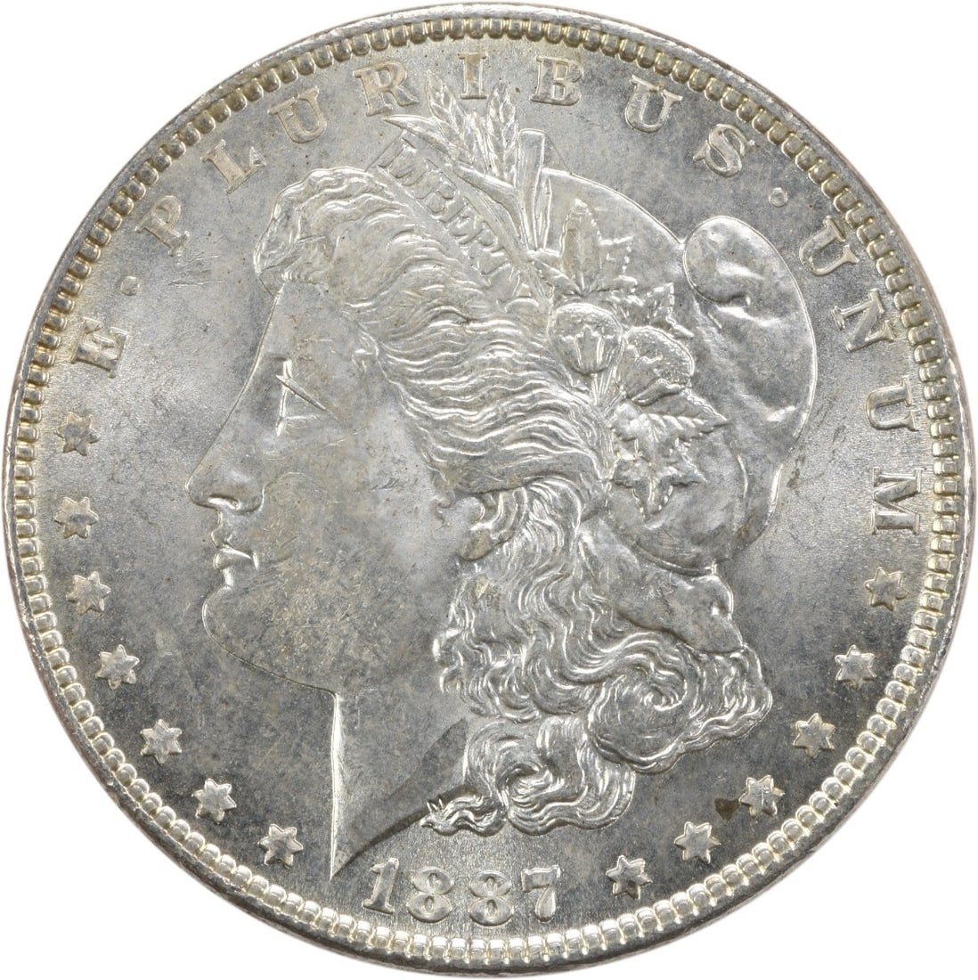 Uncirculated 1887 Morgan Silver Dollar BU Uncertified No Mint Mark: Uncirculated 1887 Morgan Silver Dollar BU Uncertified No Mint Mark This 1887 Morgan Silver Dollar is an uncirculated coin featuring brilliant uncirculated (BU) grade. It is composed of silver and was 