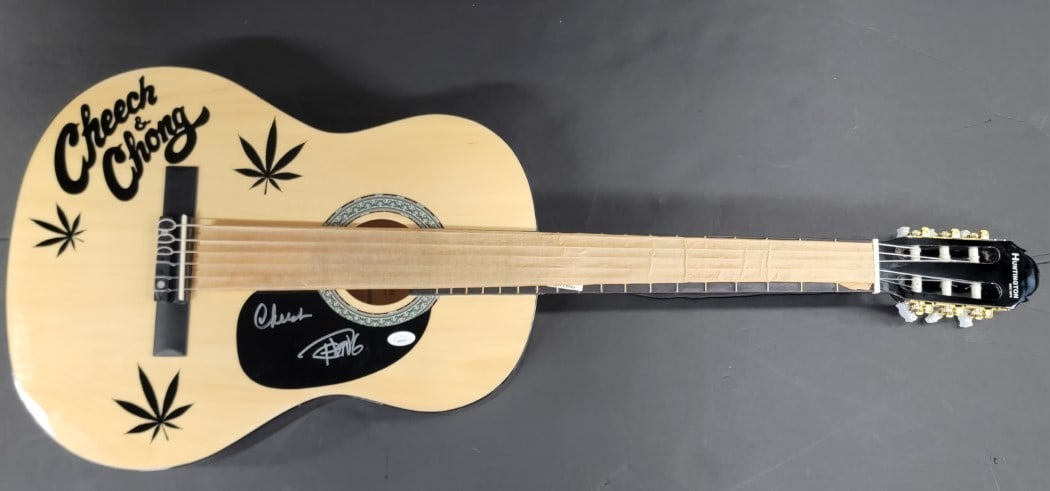 Cheech & Chong Autographed Acoustic Guitar JSA Certified: Cheech & Chong Autographed Acoustic Guitar JSA Certified This authentic acoustic guitar is hand-signed by the legendary duo Cheech Marin and Tommy Chong, making it a unique collector's item for fans a