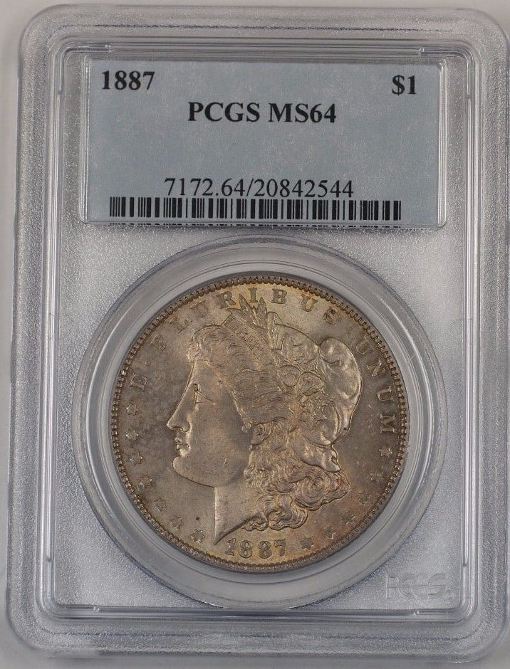 1887 Morgan Dollar Silver Coin PCGS MS 64 Toned Philadelphia Mint: 1887 Morgan Dollar Silver Coin PCGS MS 64 Toned Philadelphia Mint This 1887 US Morgan Silver Dollar is certified by PCGS with a grade of MS-64. Struck in Philadelphia, the coin features a toned finish