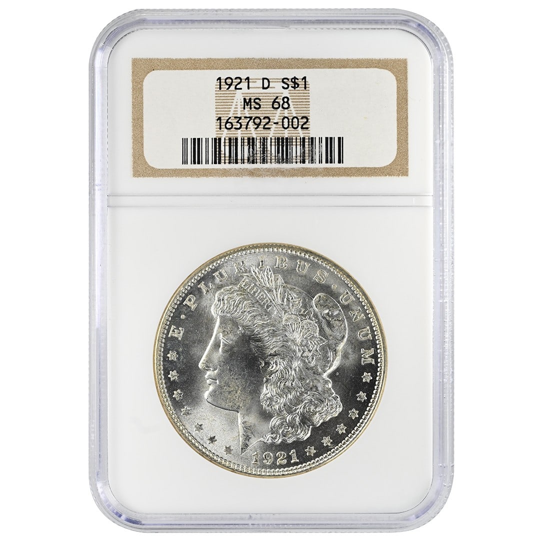 NGC MS68 1921-D Morgan Silver Dollar $1 Denver Mint: NGC MS68 1921-D Morgan Silver Dollar $1 Denver Mint 1921-D Morgan Dollar graded MS68 by NGC. This uncirculated silver $1 coin was minted in Denver and is described as white with no distracting marks. 