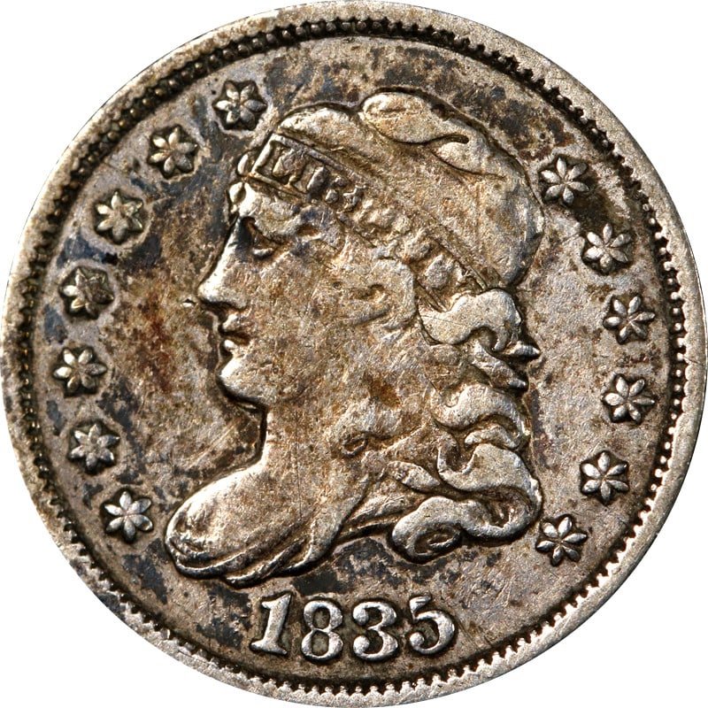 1835 Silver United States Bust Half Dime: 1835 Silver United States Bust Half Dime This 1835 Bust Half Dime is a circulated silver coin from the United States. Composed of 0.9 fineness silver, it represents a piece of early American coinage. 