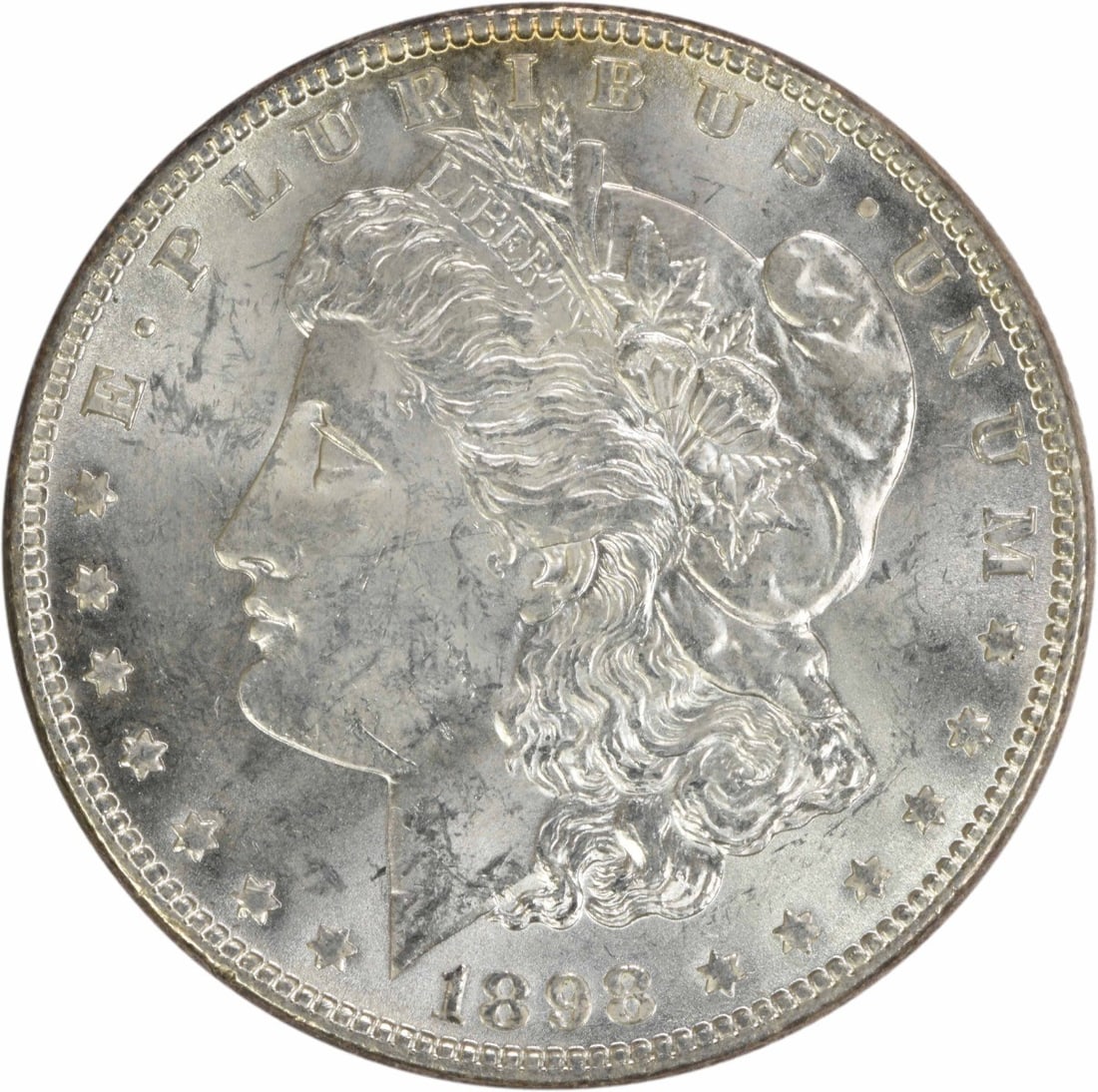 1898 Silver Morgan Dollar Brilliant Uncirculated No Mint Mark Uncertified: 1898 Silver Morgan Dollar Brilliant Uncirculated No Mint Mark Uncertified This is an uncirculated 1898 Morgan Silver Dollar with brilliant uncirculated (BU) grade. The coin is composed of silver and d