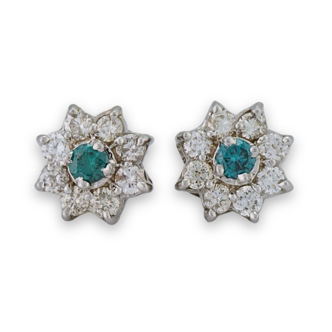 14K White Gold Blue White Diamond Cluster Screw Back Earrings: 14K White Gold Blue White Diamond Cluster Screw Back Earrings These 14K white gold cluster earrings feature a stunning combination of intense blue and white diamonds. The center stones are irradiated 