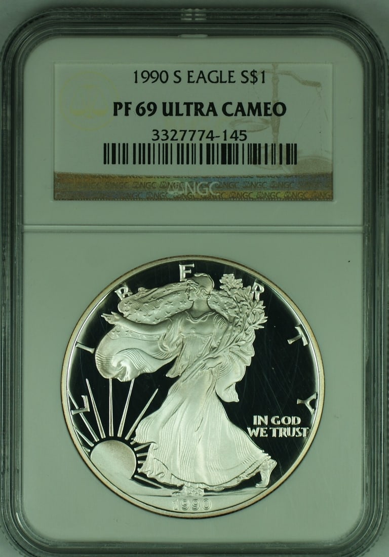 1990-S Proof Silver Eagle Dollar NGC PR 69 Ultra Cameo: 1990-S Proof Silver Eagle Dollar NGC PR 69 Ultra Cameo This 1990-S American Proof Silver Eagle features a $1 denomination and is certified by NGC with a PF 69 Ultra Cameo grade. It is a commemorative 