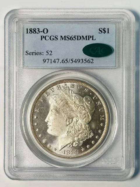 PCGS MS-65 DMPL CAC 1883-O Morgan Silver Dollar: PCGS MS-65 DMPL CAC 1883-O Morgan Silver Dollar 1883-O Morgan Silver Dollar graded MS-65 DMPL by PCGS and approved by CAC. This pre-owned silver dollar is a certified example from the New Orleans Mint