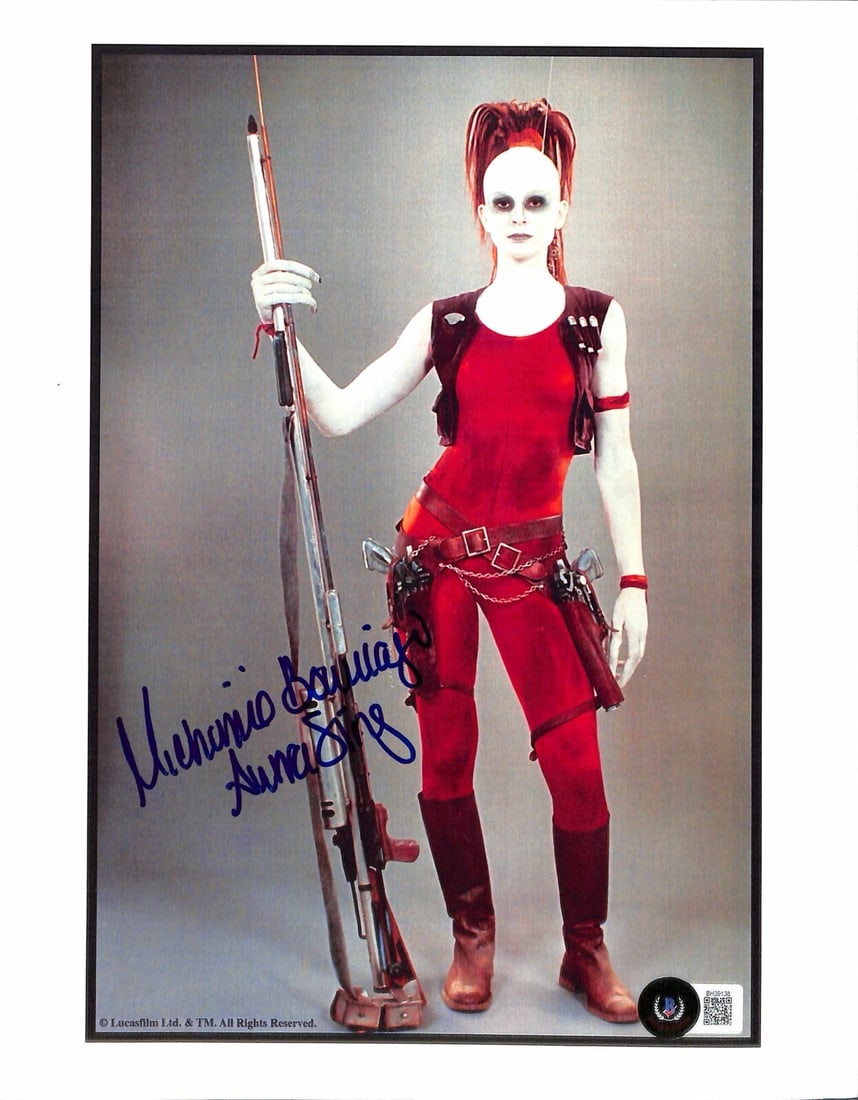 8.5 x 11 Star Wars Photo Signed by Michonne Bourriague as Aurra Sing Beckett Authenticated: 8.5 x 11 Star Wars Photo Signed by Michonne Bourriague as Aurra Sing Beckett Authenticated This is an original 8 1/2 x 11 inch color photograph signed by Michonne Bourriague, who portrayed Aurra Sing 