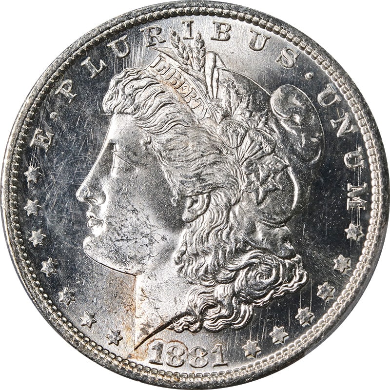 PCGS MS64 1881 San Francisco Morgan Dollar Silver Coin with Light Toning: PCGS MS64 1881 San Francisco Morgan Dollar Silver Coin with Light Toning This 1881-S Morgan Silver Dollar is graded PCGS MS64 and features a mostly bright white obverse and reverse, with minimal light